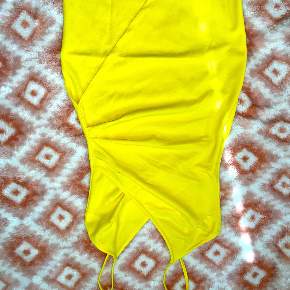 Small, yellow cocktail dress.